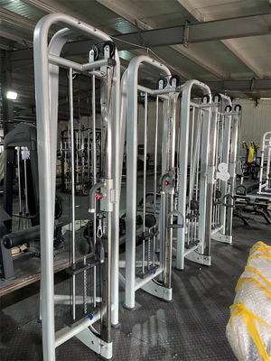 Equipo de gimnasio comercial Máquina de cruce de cable ajustable de varias estaciones con cargador medio