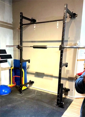 Equipo de gimnasio para el hogar Equipo de ejercicios de levantamiento de pesas Ejercicio plegable Montado en la pared Estante de sentadillas