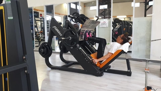Máquina de prensado de piernas de entrenamiento de fuerza comercial con carga media y selección de carga de pines
